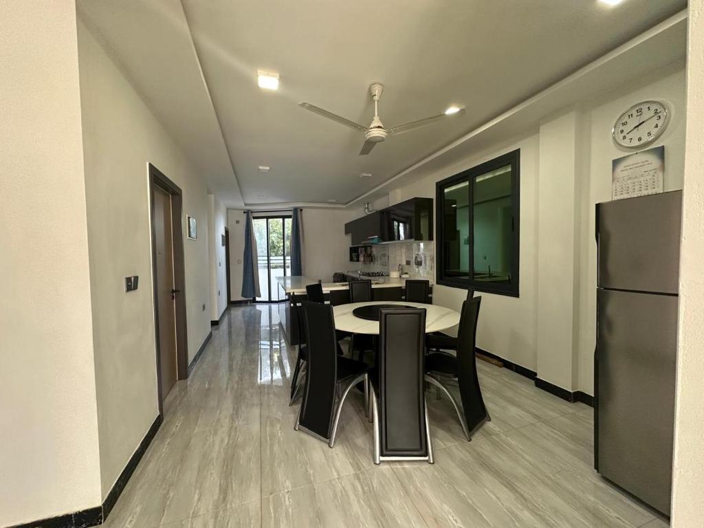 Open shared dining, kitchen and lounge area at Quest by Entrance