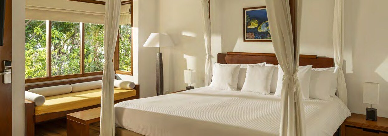 Bright bedroom in a Niva Kuramathi villa
