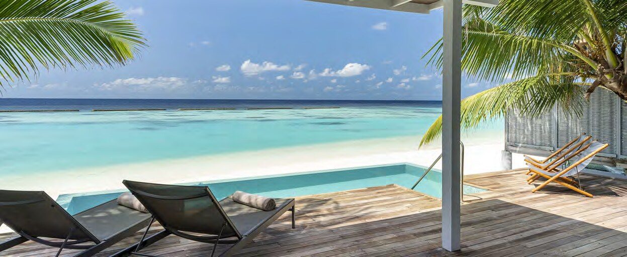 Private villa deck overlooking the turquoise lagoon